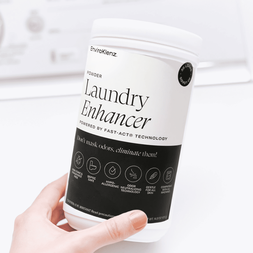Hand Holding EnviroKlenz Laundry Enhancer Powder