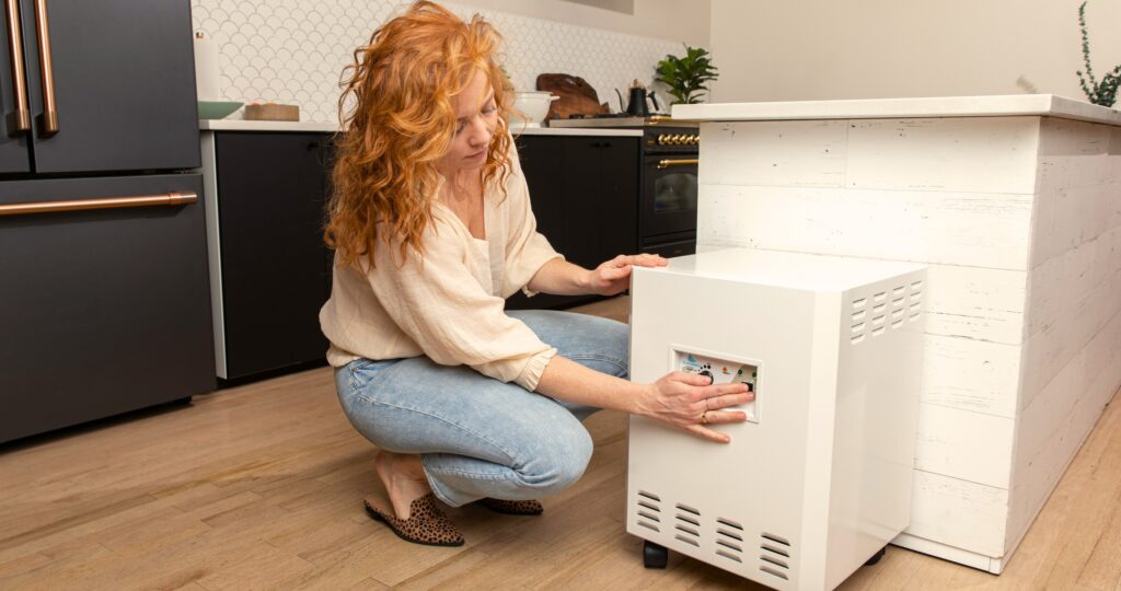 Woman using the EnviroKlenz Air System Plus