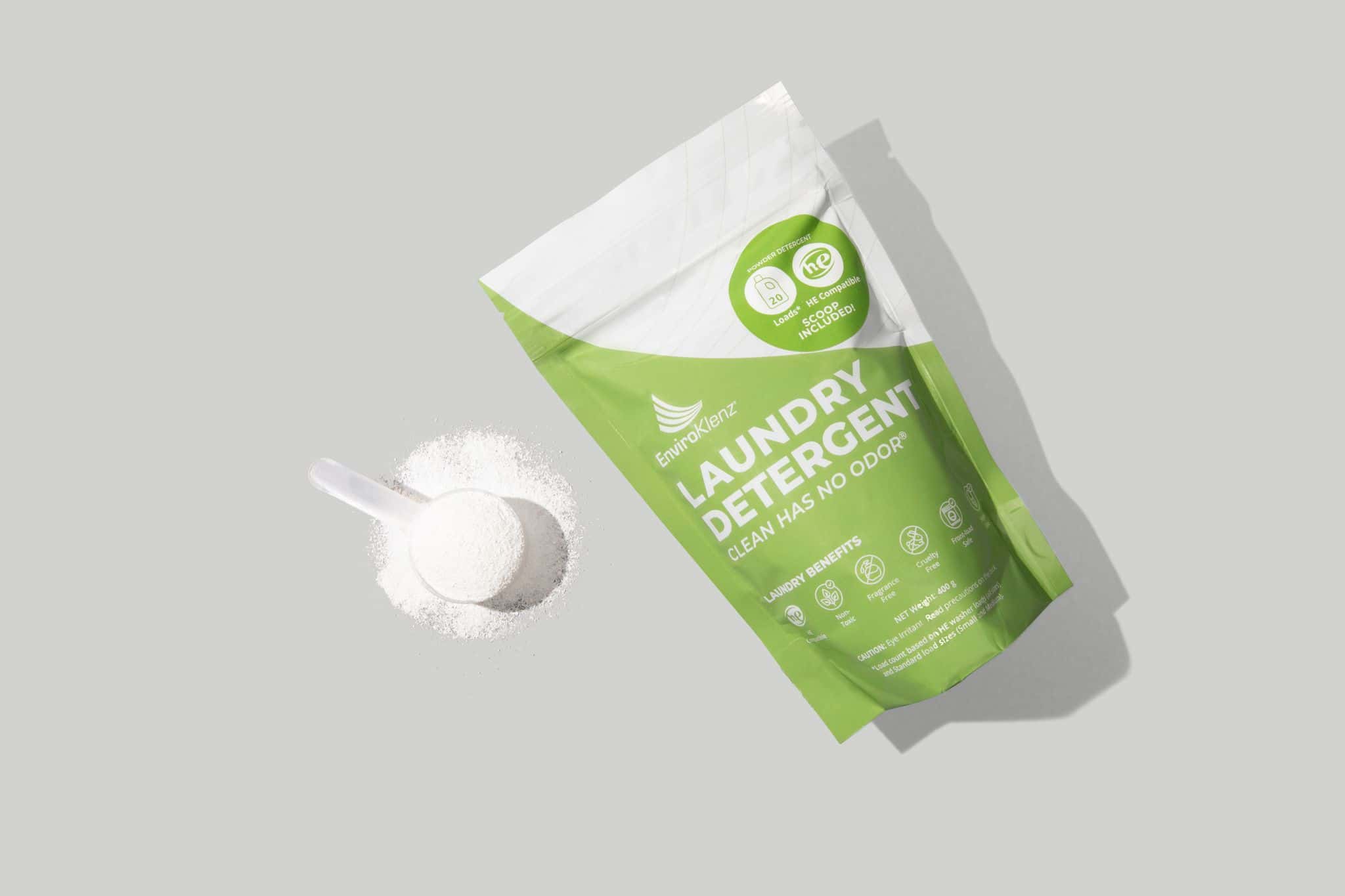 EnviroKlenz Laundry Detergent Powder With a Spoon Full of the Detergent Powder